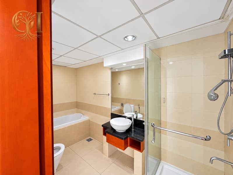7 Modern Beige Bathroom with Glass Shower. png