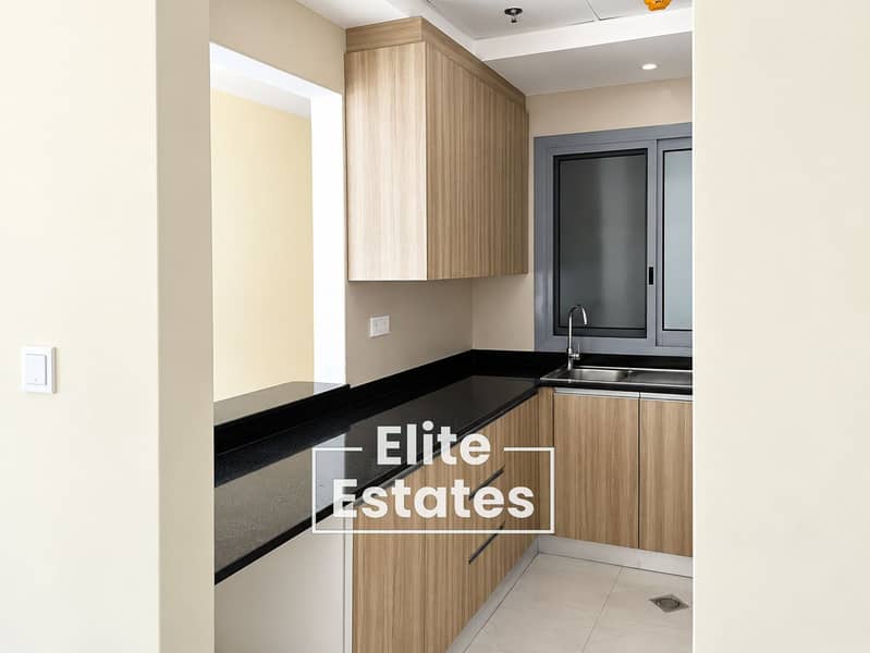 11 Minimalist Wood and Black Galley Kitchen. png