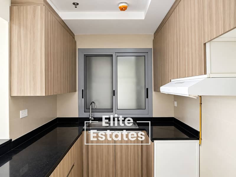 12 Modern U-Shaped Kitchen with Central Window. png