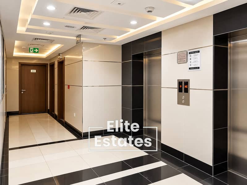 14 Modern Elevator Lobby with Fire Safety Signs. png