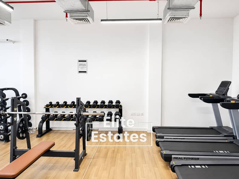 16 Modern Gym with Weights and Treadmills. png