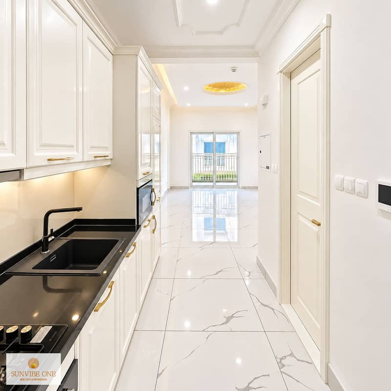 4 Bright Cream Kitchen Hallway to Balcony. png