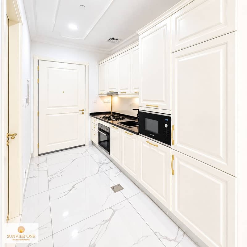 5 Bright Modern Galley Kitchen with Brass Details. png
