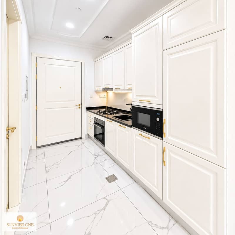 6 Bright Luxury Galley Kitchen with Brass Details. png