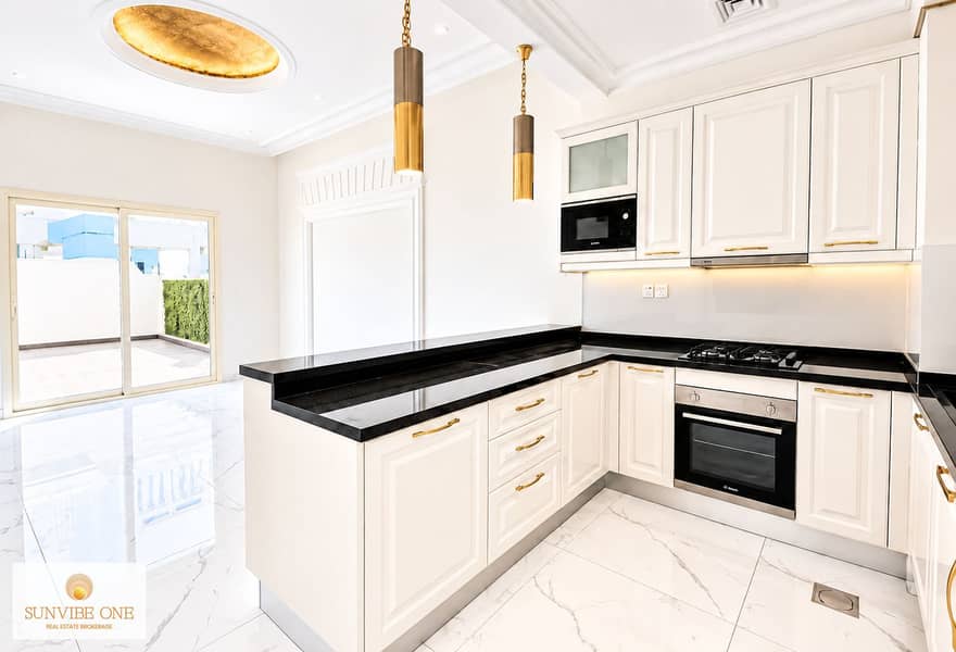 7 Bright Luxury White Kitchen with Gold Accents. png