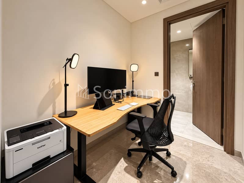 12 Minimalist Home Office with Open Bathroom Door. png