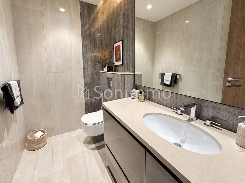 13 Modern Marble Bathroom with Warm Details. png