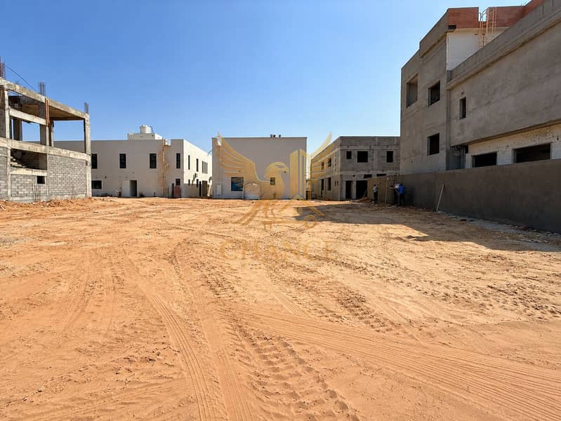 2 Modern Construction Courtyard Under Blue Skies. png