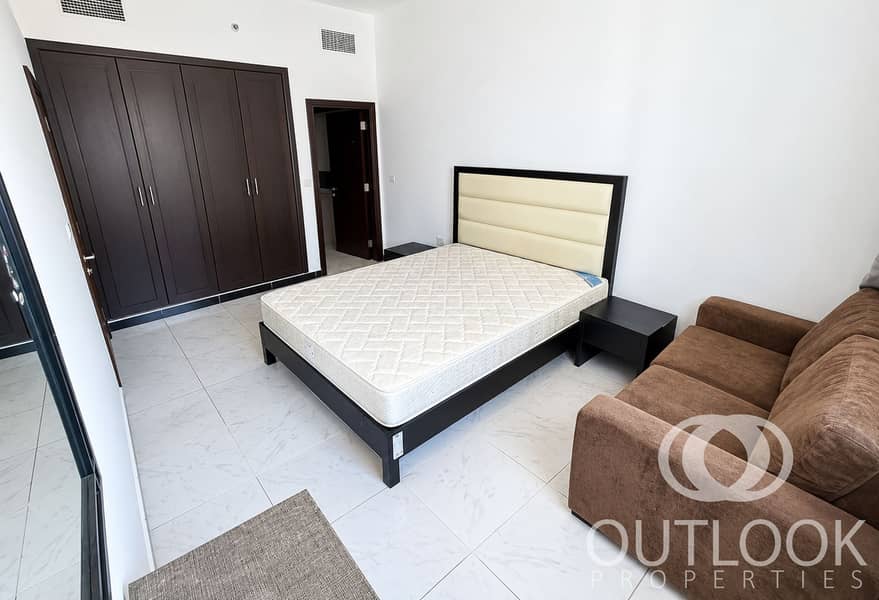 4 Bright Modern Bedroom with Brown Sofa. png