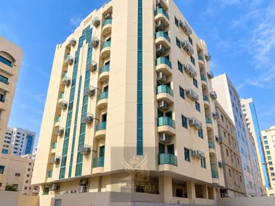 2 Bedroom Building for Sale in Al Mahatah, Sharjah - Beige High-Rise Courtyard Architecture. png 2 Bedroom Building for Sale in Al Mahatah, Sharjah - Beige High-Rise Courtyard Architecture. png