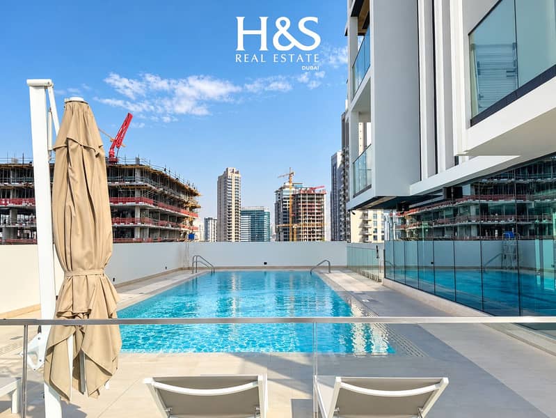 12 Sunlit Urban Rooftop Pool Skyline. png