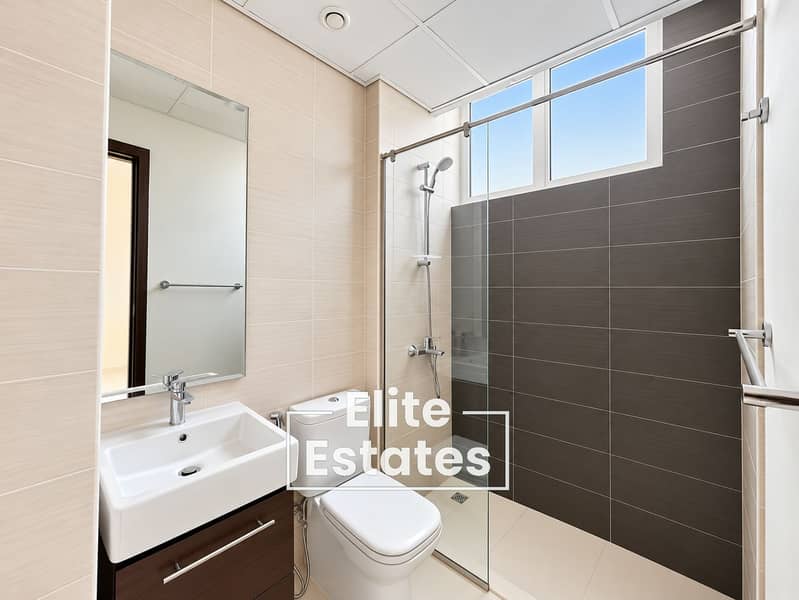 10 Bright Minimalist Bathroom with Glass Shower. png