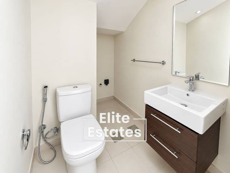 11 Minimalist Modern Bathroom with Walnut Vanity. png