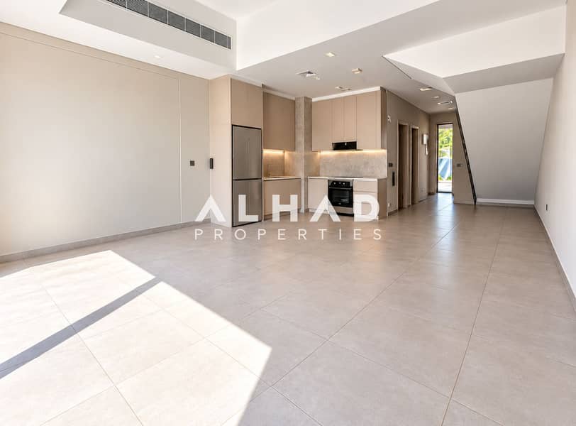 3 Sunlit Minimalist Kitchen and Living Space. png