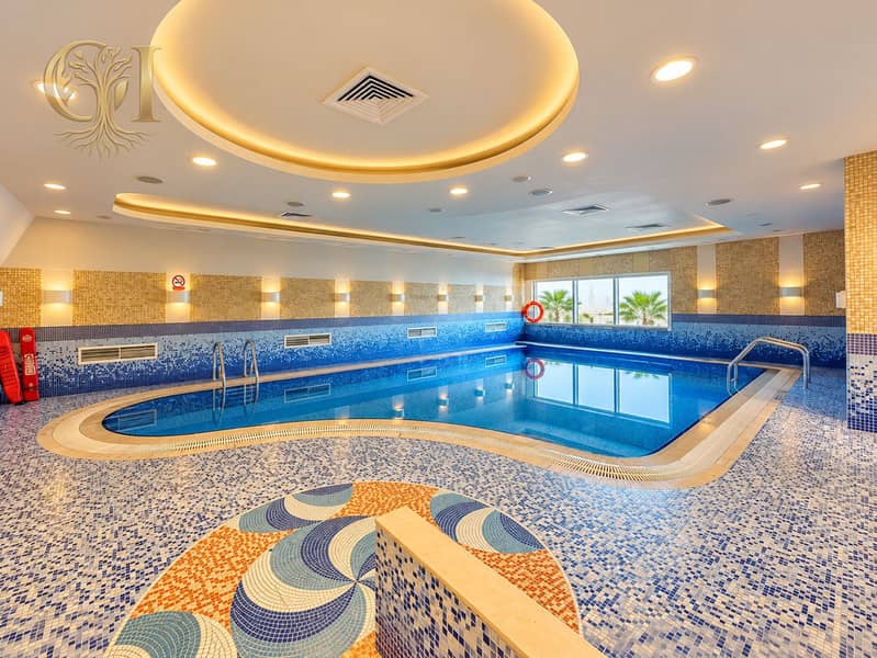15 Luxurious Indoor Pool with Mosaic Medallion. png