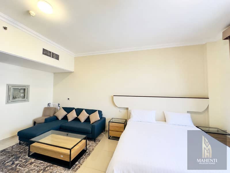 3 Modern Hotel Studio with Neatly Made Bed. png