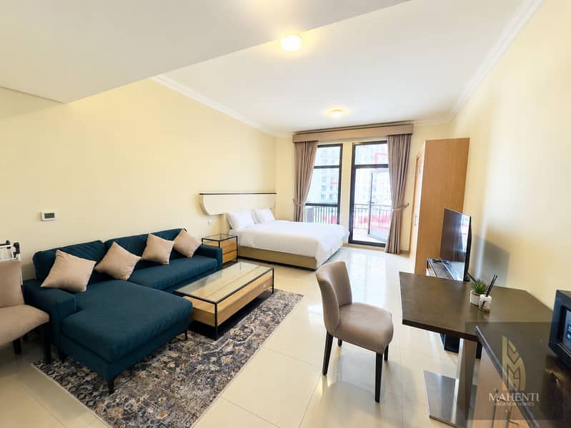 4 Bright Modern Studio with Neatly Made Bed. png
