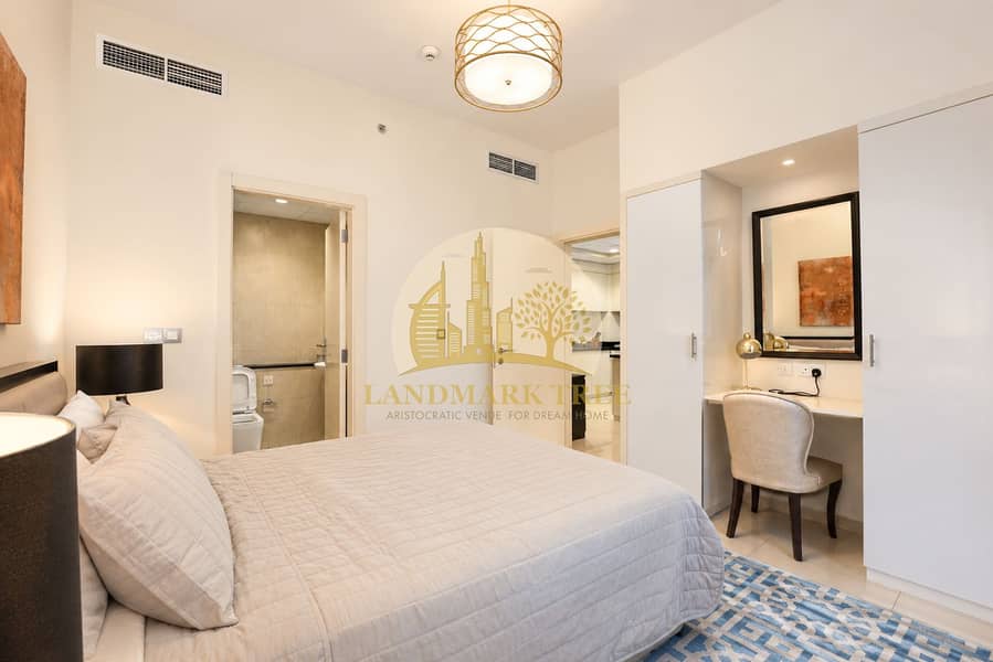 7 Modern Neutral Bedroom with Vanity and Open Doorways. png
