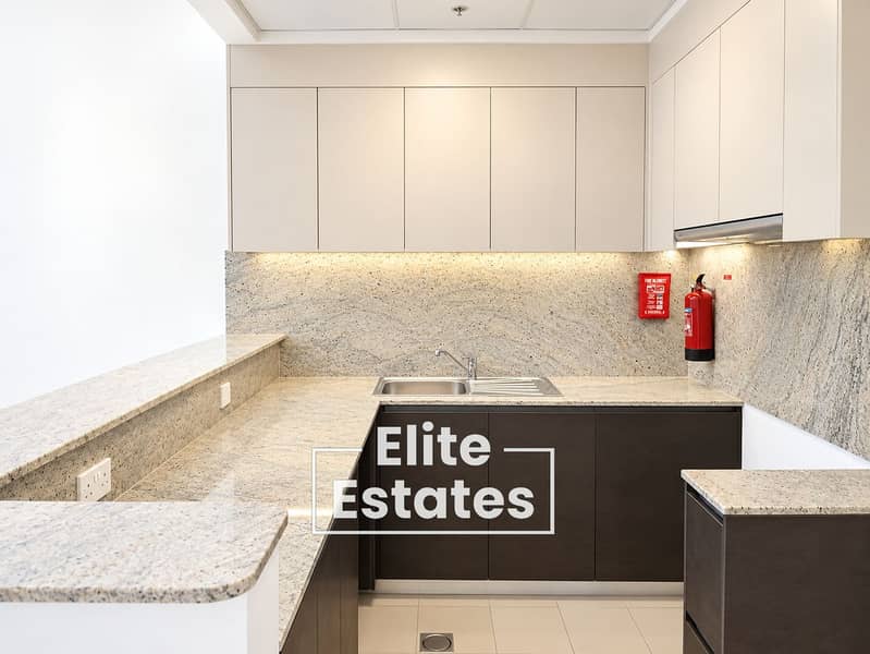 8 Modern Minimalist Kitchen with Fire Safety Accents. png