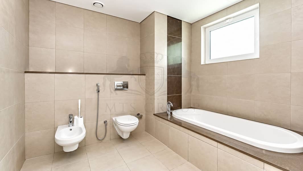 9 Modern Taupe Bathroom with Built-In Tub. png