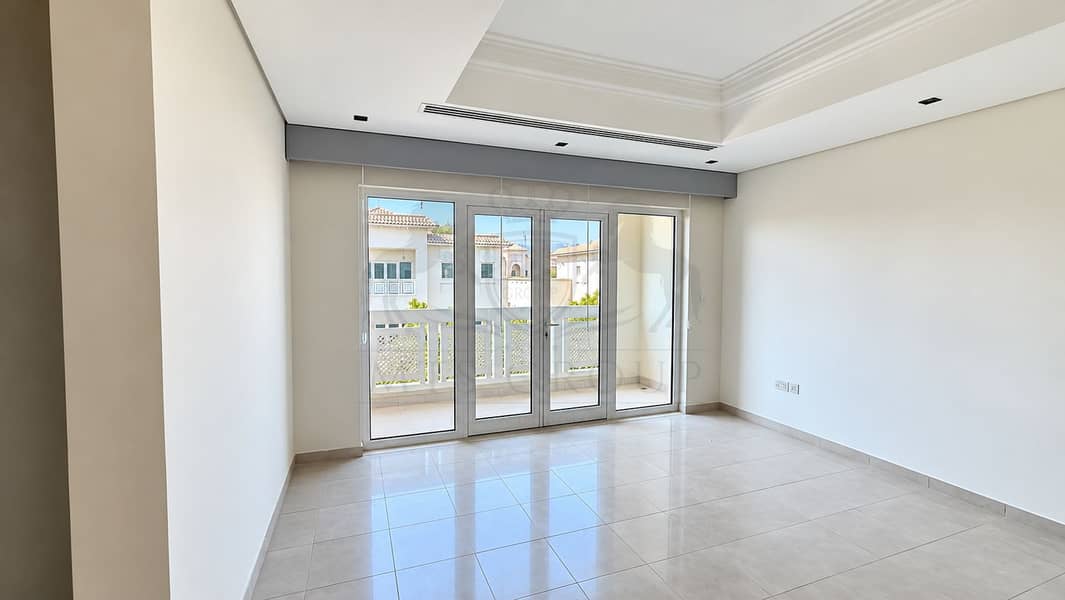 13 Sunlit Minimalist Room with Balcony Views. png