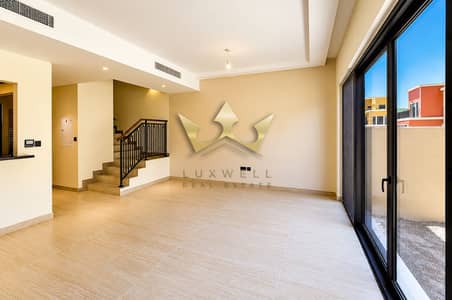 3 Bedroom Townhouse for Rent in DAMAC Lagoons, Dubai - Bright Modern Living Room with Sliding Glass Doors. png 3 Bedroom Townhouse for Rent in DAMAC Lagoons, Dubai - Bright Modern Living Room with Sliding Glass Doors. png