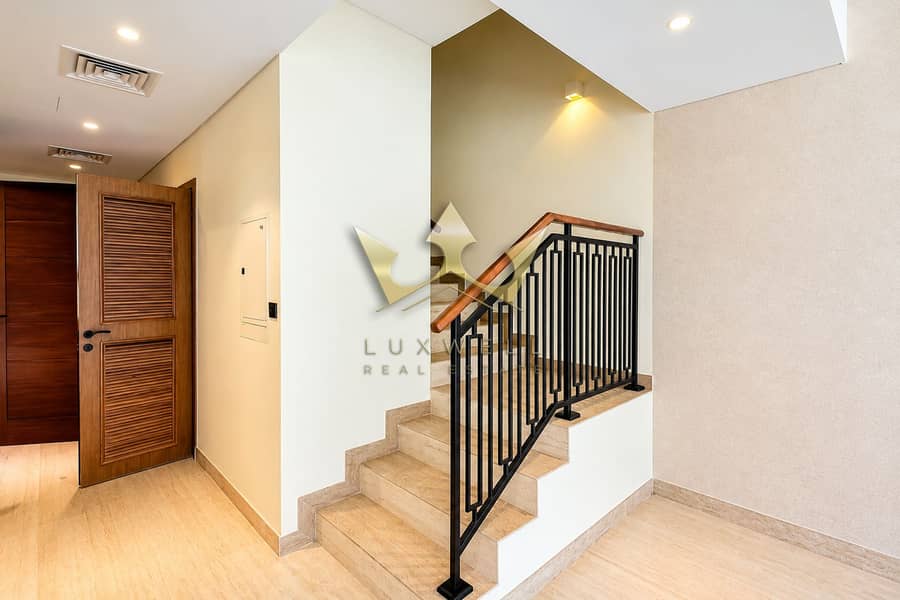 3 Modern Foyer with Marble Staircase. png
