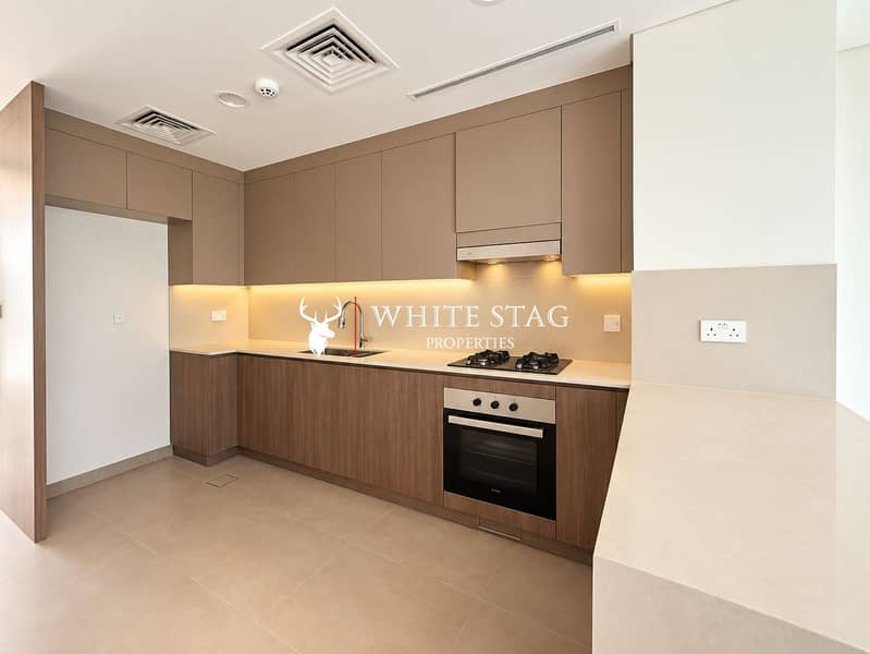 6 Modern Taupe and Wood Kitchen. png