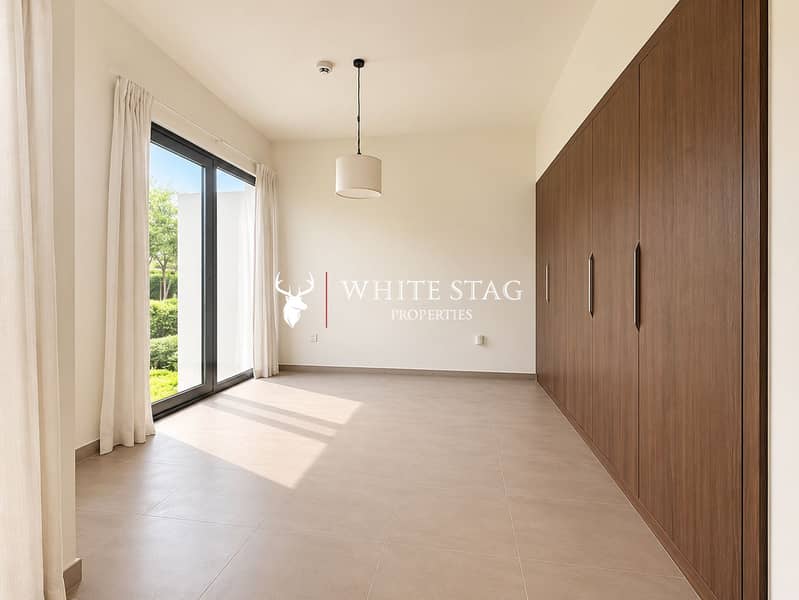 8 Bright Minimalist Room with Walnut Wardrobes. png