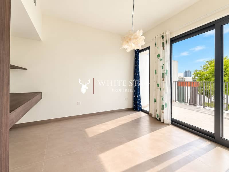 11 Sunlit Minimalist Room with Balcony Views. png