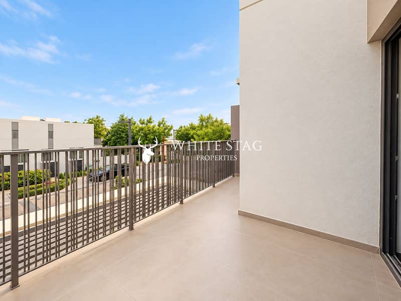 12 Modern Balcony Overlooking a Quiet Neighborhood. png
