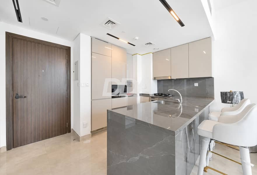 3 Modern Marble Kitchen with Brass Accents. png