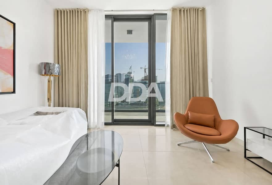 8 Minimalist Cityview Room with Cozy Leather Chair. png