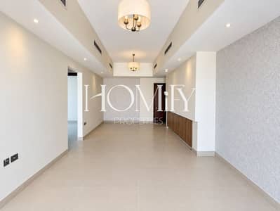 فلیٹ 2 غرفة نوم للايجار في قرية جميرا الدائرية، دبي - Modern Empty Living and Dining Interior. png