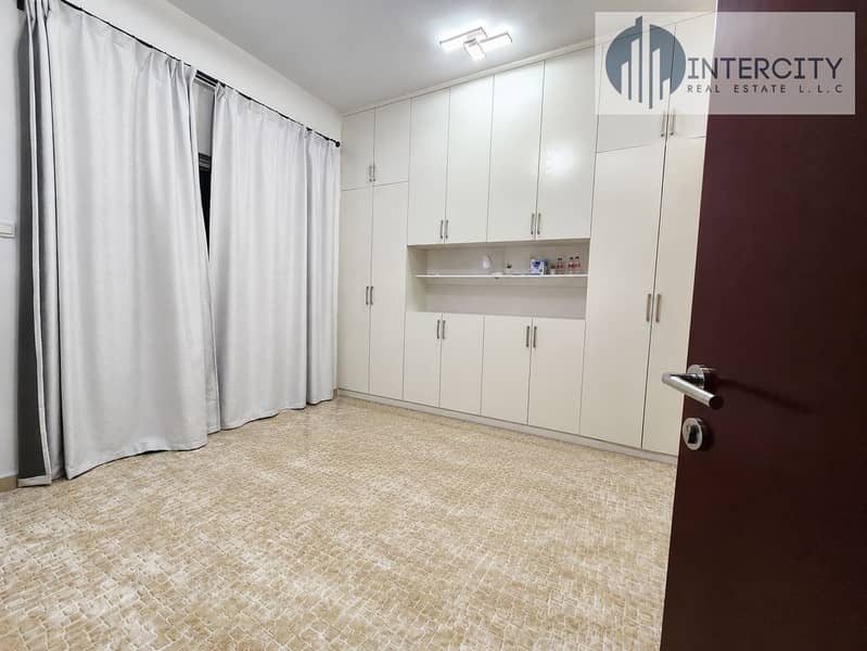 7 Bright Empty Bedroom with Built-In Wardrobes. png