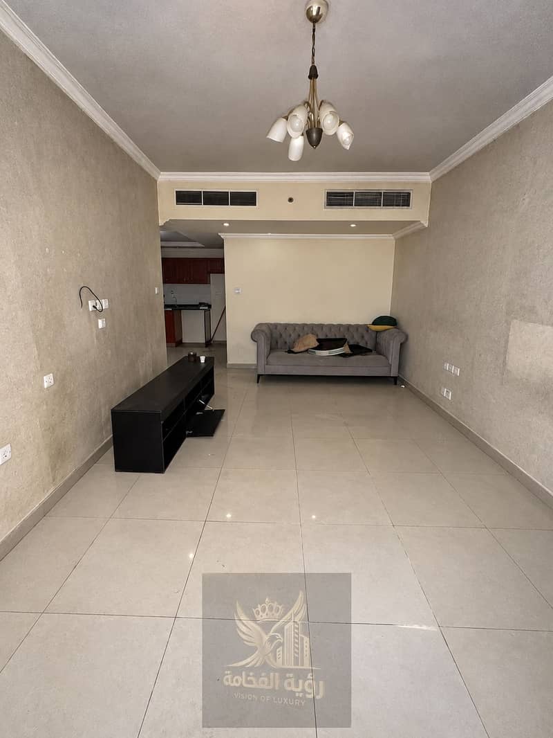 Empty Beige Living Room with Chandelier and Sofa. png Empty Beige Living Room with Chandelier and Sofa. png