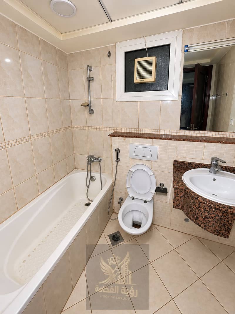 3 Clean Beige-Tiled Bathroom Interior. png
