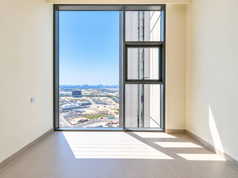 9 Sunlit Modern Room with Urban Views. png