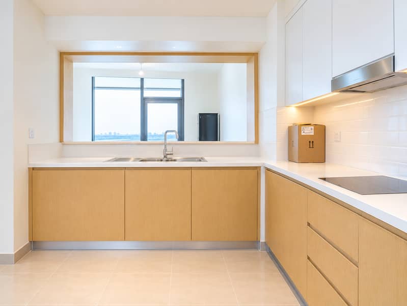 18 Bright Scandinavian Kitchen with Sink and Pass-Through Window. png