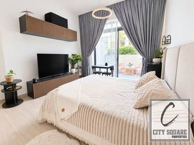 Studio for Sale in Jumeirah Village Circle (JVC), Dubai - resize_Bright Neutral Bedroom with Blank TV. jpg