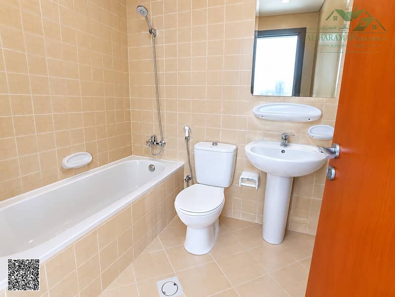 6 Clean Modern Beige-Tiled Bathroom. jpg