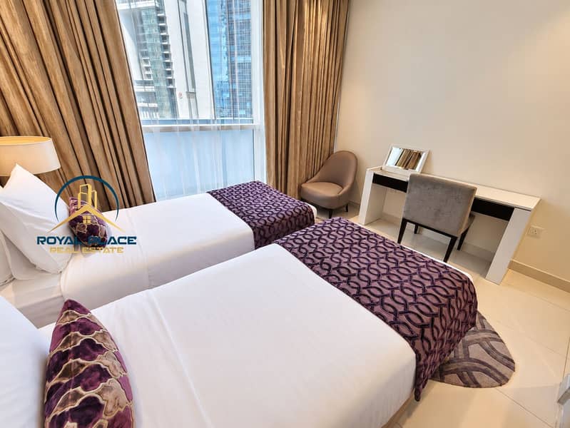 6 Inviting twin bedroom with purple accents. png
