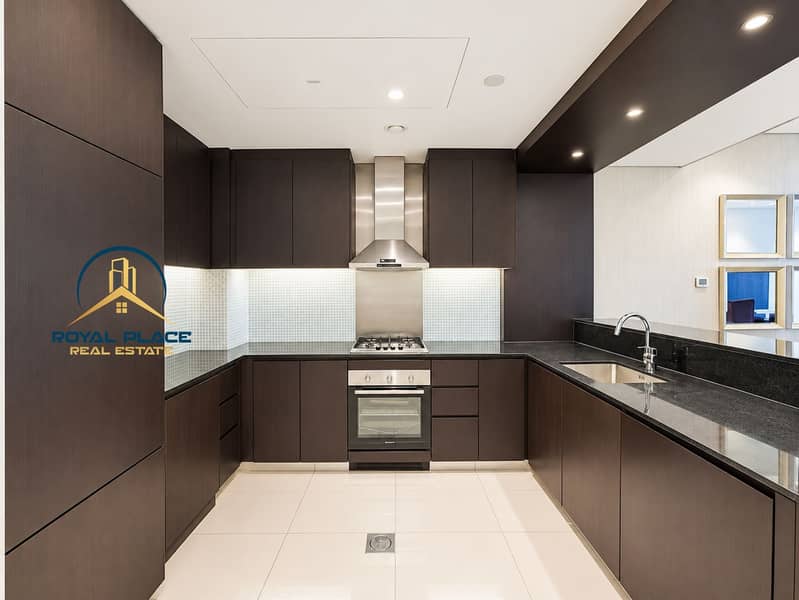 7 Brightened dark-wood kitchen listing photo (1). png