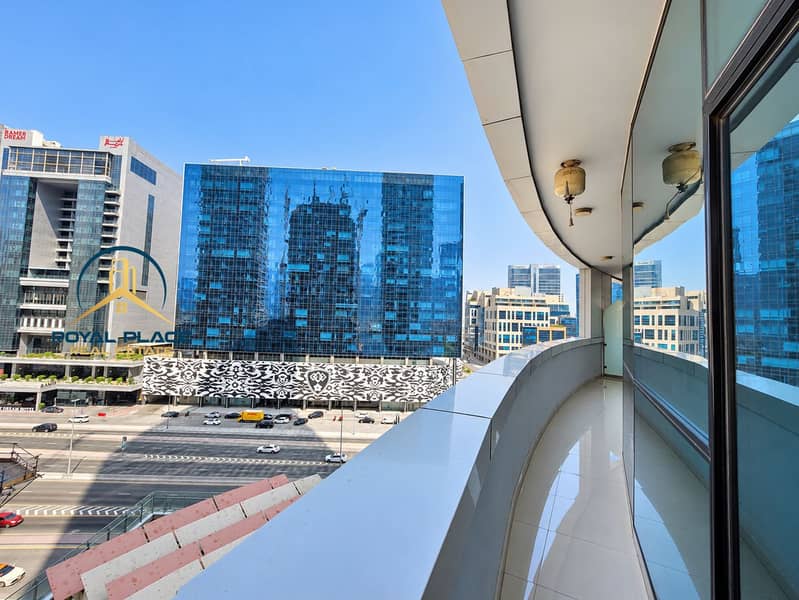 10 Curved Balcony Overlooking Blue Glass Towers. png
