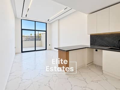 استوديو  للايجار في أرجان، دبي - Minimalist Apartment with Marble Kitchen and Balcony. png