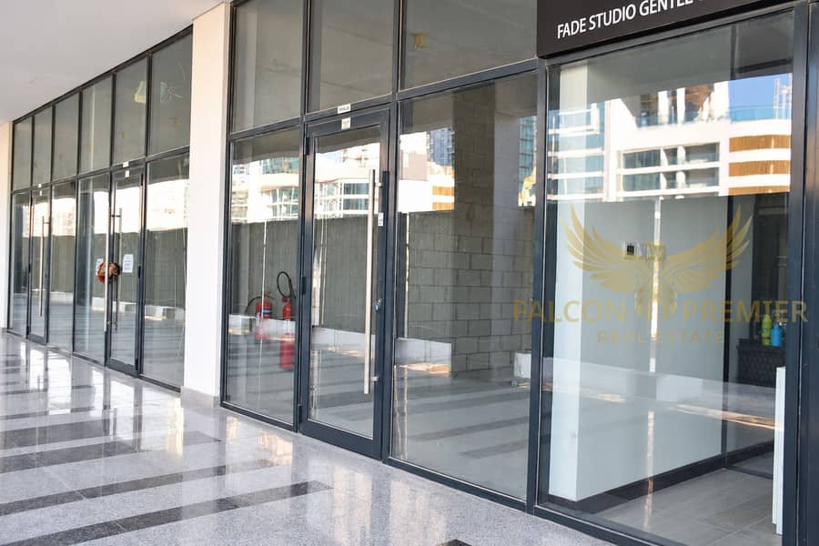 7 Brightened retail corridor with glass storefronts-2. png