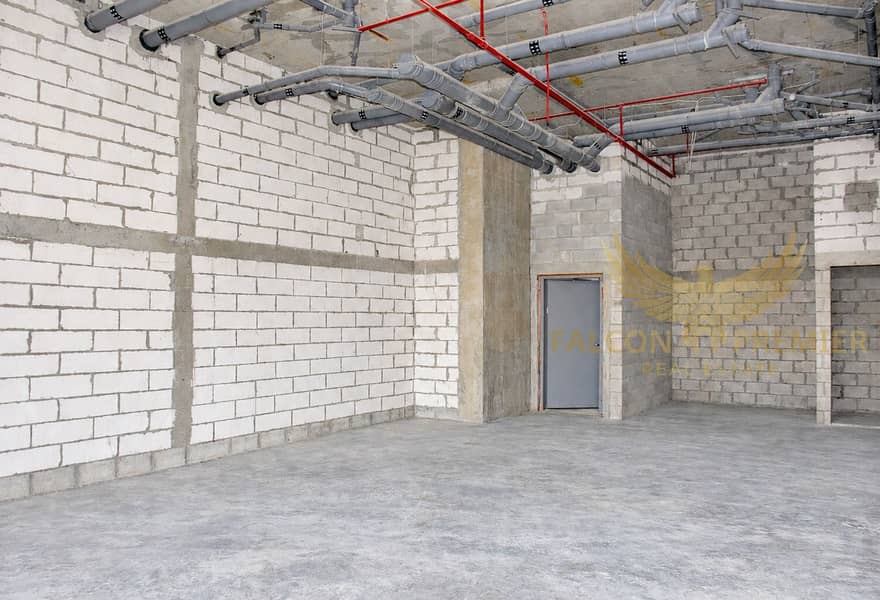 4 Brightened raw concrete shell-and-core interior-1. png