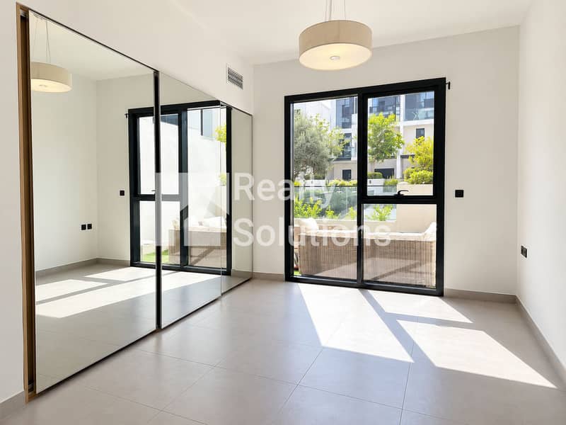 2 Bright Minimalist Room with Mirrored Wardrobe. png