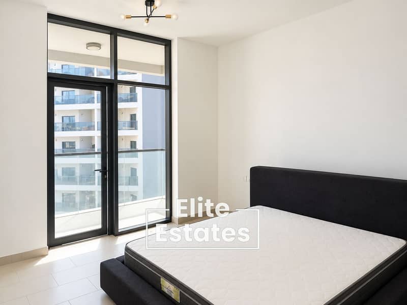 2 Bright Minimalist Bedroom with Balcony View. png