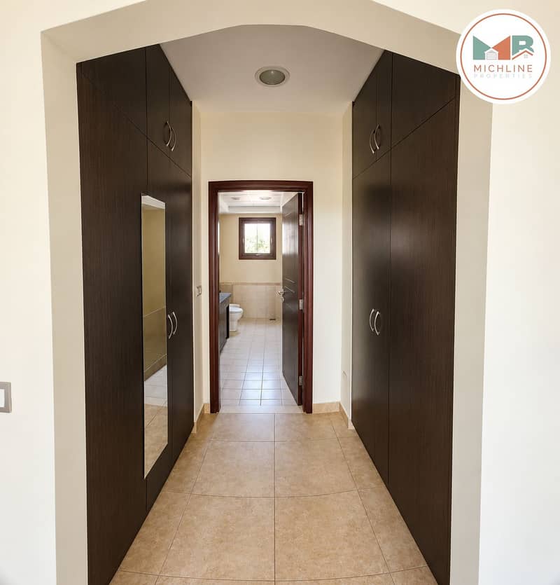 14 Bright Neutral Hallway to Bathroom. png